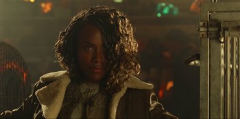 Movie still from “Jurassic World Dominion” (2022), directed by Colin Trevorrow – A person with curly hair; Close Up shot, Over the shoulder angle