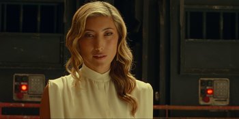 Movie still from “Jurassic World Dominion” (2022), directed by Colin Trevorrow – A woman with long blonde hair wearing a white shirt; Close Up shot, Low angle