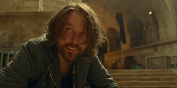 Movie still from “Jurassic World Dominion” (2022), directed by Colin Trevorrow – A person with long hair; Close Up shot, Over the shoulder angle