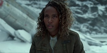 Movie still from “Jurassic World Dominion” (2022), directed by Colin Trevorrow – A person wearing a jacket; Close Up shot, Over the shoulder angle