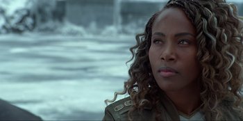 Movie still from “Jurassic World Dominion” (2022), directed by Colin Trevorrow – A person wearing a jacket; Close Up shot, Over the shoulder angle