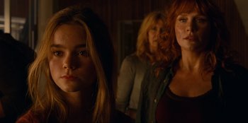 Movie still from “Jurassic World Dominion” (2022), directed by Colin Trevorrow – A group of women standing next to each other; Close Up shot, Over the shoulder angle