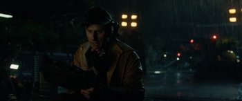 Movie still from “Jurassic World: Fallen Kingdom” (2018), directed by J.A. Bayona – A man in a brown jacket is holding a cell phone; Close Up shot, Low angle