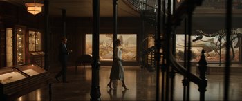 Movie still from “Jurassic World: Fallen Kingdom” (2018), directed by J.A. Bayona – A woman walking in a room with a spiral staircase; Wide shot, Low angle