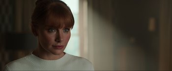 Movie still from “Jurassic World: Fallen Kingdom” (2018), directed by J.A. Bayona – A person wearing a white shirt; Close Up shot, Over the shoulder angle