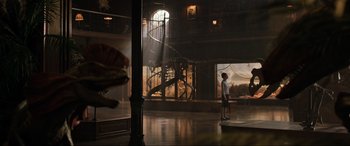 Movie still from “Jurassic World: Fallen Kingdom” (2018), directed by J.A. Bayona – A man standing in a room next to an animal skeleton; Extreme Wide shot, Low angle