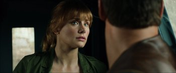 Movie still from “Jurassic World: Fallen Kingdom” (2018), directed by J.A. Bayona – A person looking at a mirror; Close Up shot, Over the shoulder angle