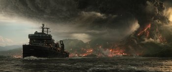 Movie still from “Jurassic World: Fallen Kingdom” (2018), directed by J.A. Bayona – A ship in the water with a bunch of smoke coming out of it; Extreme Wide shot, High angle