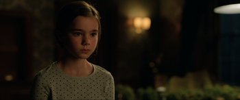 Movie still from “Jurassic World: Fallen Kingdom” (2018), directed by J.A. Bayona – A young girl is looking at the camera; Close Up shot, Over the shoulder angle