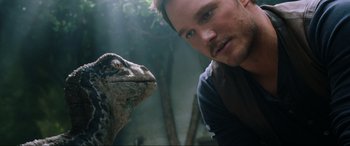 Movie still from “Jurassic World: Fallen Kingdom” (2018), directed by J.A. Bayona – Chris pratt and a dinosaur in a forest; Close Up shot, Over the shoulder angle