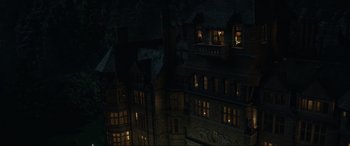 Movie still from “Jurassic World: Fallen Kingdom” (2018), directed by J.A. Bayona – An image of a building that is lit up at night; Extreme Wide shot, High angle