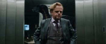 Movie still from “Jurassic World: Fallen Kingdom” (2018), directed by J.A. Bayona – A man in a suit and a tie; Medium shot, Over the shoulder angle