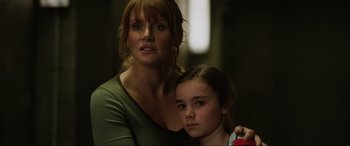 Movie still from “Jurassic World: Fallen Kingdom” (2018), directed by J.A. Bayona – A woman and a girl pose for a picture; Close Up shot, Low angle