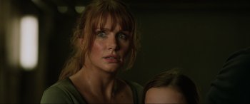 Movie still from “Jurassic World: Fallen Kingdom” (2018), directed by J.A. Bayona – A person with green eyes; Close Up shot, Low angle