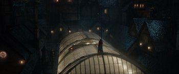 Movie still from “Jurassic World: Fallen Kingdom” (2018), directed by J.A. Bayona – A person standing on a platform at night; Extreme Wide shot, High angle