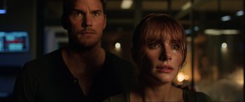Movie still from “Jurassic World: Fallen Kingdom” (2018), directed by J.A. Bayona – A man and a woman standing next to each other in the dark; Close Up shot, Over the shoulder angle