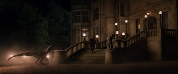 Movie still from “Jurassic World: Fallen Kingdom” (2018), directed by J.A. Bayona – A man walking up a set of stairs at night; Extreme Wide shot, High angle