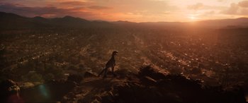 Movie still from “Jurassic World: Fallen Kingdom” (2018), directed by J.A. Bayona – A bird sitting on top of a hill at sunset; Extreme Wide shot, High angle