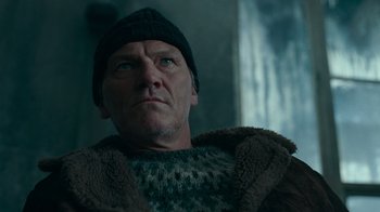 Movie still from “Justice League” (2017), directed by Zack Snyder – A person wearing a hat; Close Up shot, Low angle