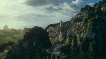 Movie still from “Justice League” (2017), directed by Zack Snyder – An aerial view of a mountain and a bridge; Extreme Wide shot, High angle