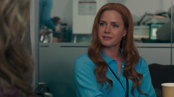 Movie still from “Justice League” (2017), directed by Zack Snyder – A person wearing a blue shirt; Close Up shot, Over the shoulder angle