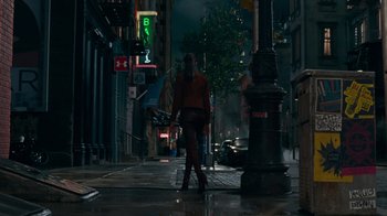 Movie still from “Justice League” (2017), directed by Zack Snyder – A person walking down a street in the rain at night; Wide shot, Low angle