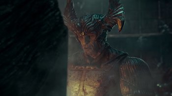 Movie still from “Justice League” (2017), directed by Zack Snyder – A man with a horned helmet on his head; Close Up shot, Low angle