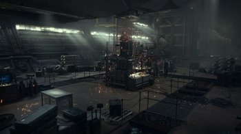 Movie still from “Justice League” (2017), directed by Zack Snyder – A factory with a lot of machines in it; Extreme Wide shot, High angle