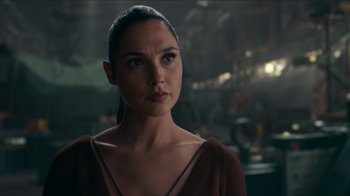 Movie still from “Justice League” (2017), directed by Zack Snyder – Gal gadot as wonder woman in a scene from batman v; Close Up shot, Over the shoulder angle