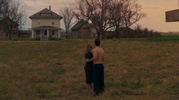 Movie still from “Justice League” (2017), directed by Zack Snyder – A man and a woman standing in a field; Extreme Wide shot, Low angle