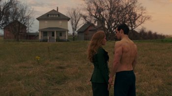 Movie still from “Justice League” (2017), directed by Zack Snyder – A man and a woman standing in a field; Wide shot, Over the shoulder angle