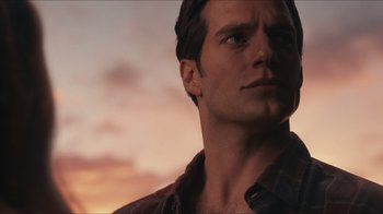 Movie still from “Justice League” (2017), directed by Zack Snyder – A person wearing a flannel shirt; Close Up shot, Over the shoulder angle