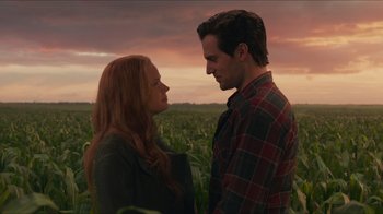 Movie still from “Justice League” (2017), directed by Zack Snyder – A man and a woman standing next to each other in a corn field; Medium shot, Low angle