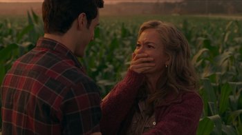 Movie still from “Justice League” (2017), directed by Zack Snyder – A man and a woman are standing in front of a corn field; Close Up shot, Over the shoulder angle