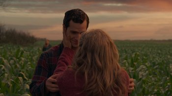 Movie still from “Justice League” (2017), directed by Zack Snyder – A man and a woman hugging in a field; Close Up shot, Over the shoulder angle