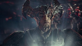 Movie still from “Justice League” (2017), directed by Zack Snyder – A person wearing a helmet with horns; Close Up shot, Over the shoulder angle