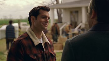 Movie still from “Justice League” (2017), directed by Zack Snyder – A man in a plaid jacket standing next to another man in a plaid jacket; Close Up shot, Over the shoulder angle