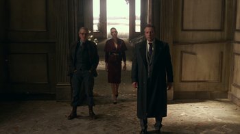 Movie still from “Justice League” (2017), directed by Zack Snyder – A group of people standing in an old building; Wide shot, Low angle
