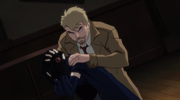 Movie still from “Justice League Dark: Apokolips War” (2020), directed by Christina Sotta – A man in a trench coat and tie holding onto a glove; Medium shot, Over the shoulder angle