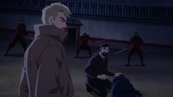 Movie still from “Justice League Dark: Apokolips War” (2020), directed by Christina Sotta – A group of men in a courtyard with a building in the background; Medium shot, Over the shoulder angle