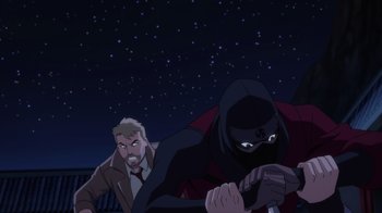 Movie still from “Justice League Dark: Apokolips War” (2020), directed by Christina Sotta – Two men in suits and one is wearing a black mask and the other is wearing a black mask; Medium shot, Over the shoulder angle