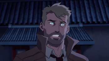 Movie still from “Justice League Dark: Apokolips War” (2020), directed by Christina Sotta – A man with a goatee is looking at the camera; Close Up shot, Over the shoulder angle