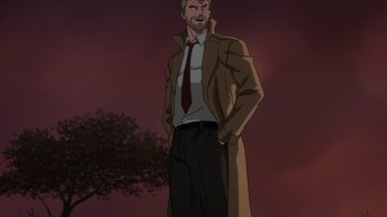Movie still from “Justice League Dark: Apokolips War” (2020), directed by Christina Sotta – A man in a trench coat and tie standing next to a tree; Medium shot, Low angle