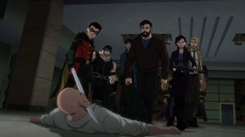 Movie still from “Justice League Dark: Apokolips War” (2020), directed by Christina Sotta – A group of people standing next to each other in a room; Wide shot, High angle