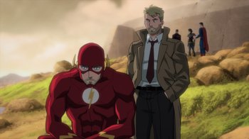 Movie still from “Justice League Dark: Apokolips War” (2020), directed by Christina Sotta – A man standing next to a man wearing a suit; Medium shot, Over the shoulder angle