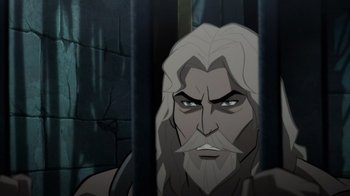 Movie still from “Justice League: Warworld” (2023), directed by Jeff Wamester – An image of a man with long hair and a white beard; Close Up shot, High angle