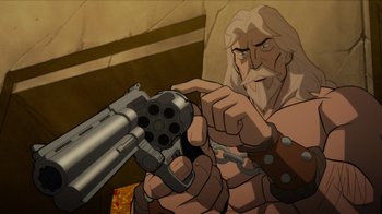 Movie still from “Justice League: Warworld” (2023), directed by Jeff Wamester – An old man is holding a gun and pointing to the camera; Medium shot, High angle