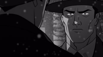 Movie still from “Justice League: Warworld” (2023), directed by Jeff Wamester – A black and white image of a man in a hat; Close Up shot, Over the shoulder angle