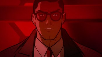 Movie still from “Justice League: Warworld” (2023), directed by Jeff Wamester – An animated man wearing a suit and glasses; Close Up shot, Over the shoulder angle