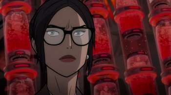 Movie still from “Justice League: Warworld” (2023), directed by Jeff Wamester – A woman with glasses is looking at the camera; Close Up shot, Over the shoulder angle